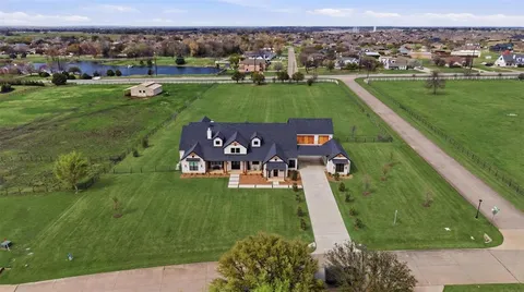 an aerial view of a house with a garden