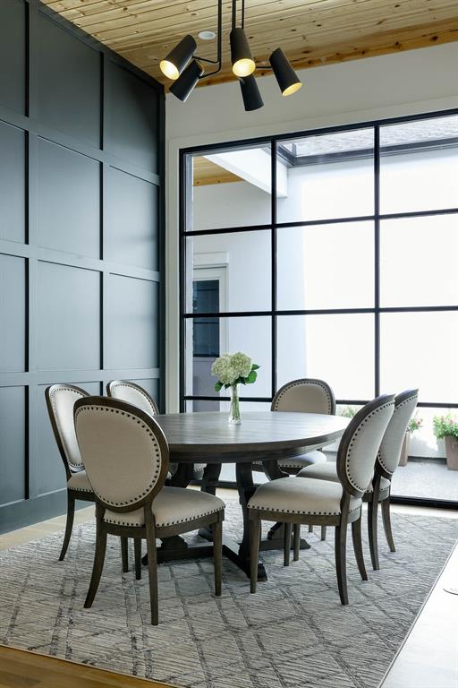 7149 Northaven Road Dallas, TX 75230 - Photo 11 of 25 a view of a dining room with furniture and window