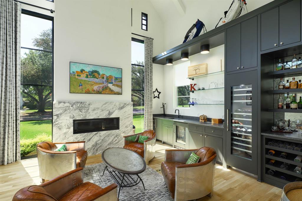 7149 Northaven Road Dallas, TX 75230 - Photo 12 of 25 a living room with furniture a fireplace and a large window