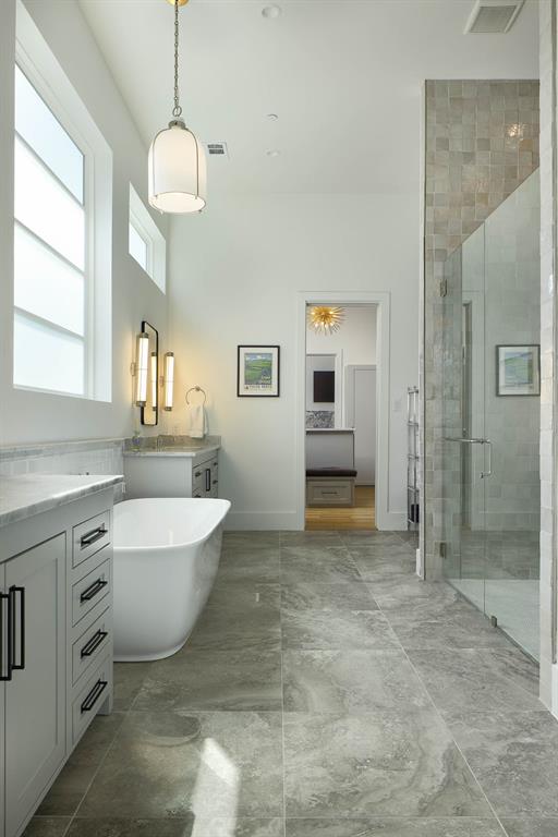 7149 Northaven Road Dallas, TX 75230 - Photo 13 of 25 a spacious bathroom with a granite countertop sink mirror bathtub and toilet