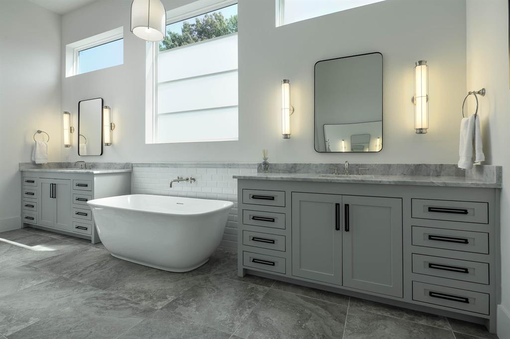7149 Northaven Road Dallas, TX 75230 - Photo 14 of 25 a spacious bathroom with a granite countertop sink mirror and a bathtub