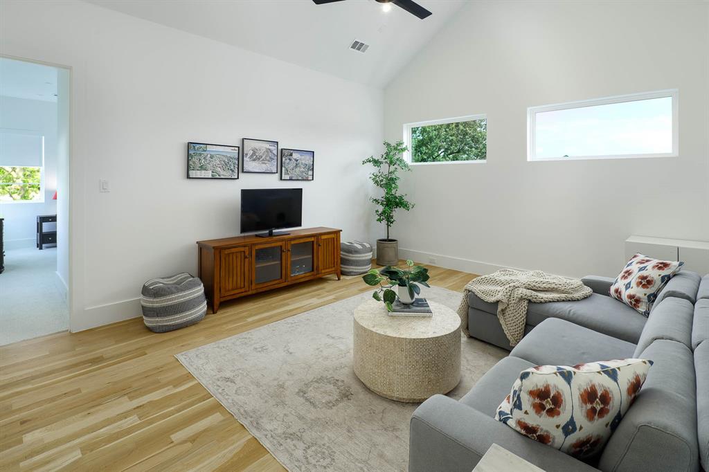 7149 Northaven Road Dallas, TX 75230 - Photo 17 of 25 a living room with furniture and a couch