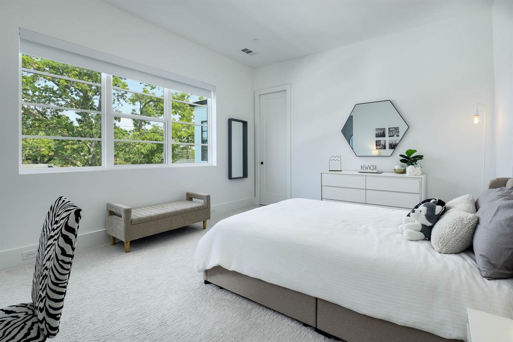 7149 Northaven Road Dallas, TX 75230 - Photo 18 of 25 a bedroom with a bed and a couch