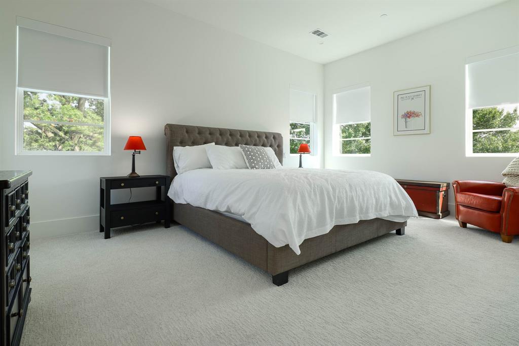 7149 Northaven Road Dallas, TX 75230 - Photo 19 of 25 a bedroom with a bed and a couch