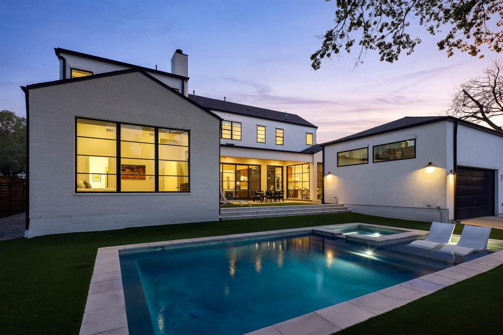 7149 Northaven Road Dallas, TX 75230 - Photo 22 of 25 a view of a house with a swimming pool