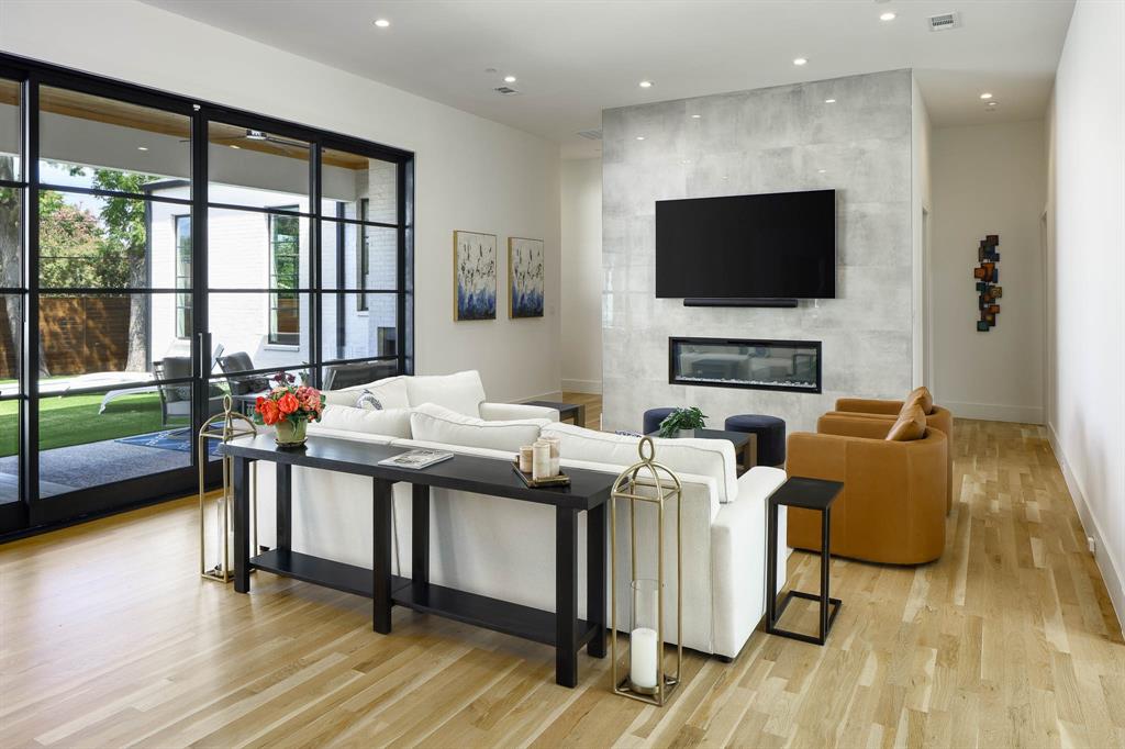 7149 Northaven Road Dallas, TX 75230 - Photo 7 of 25 a living room with furniture and a flat screen tv