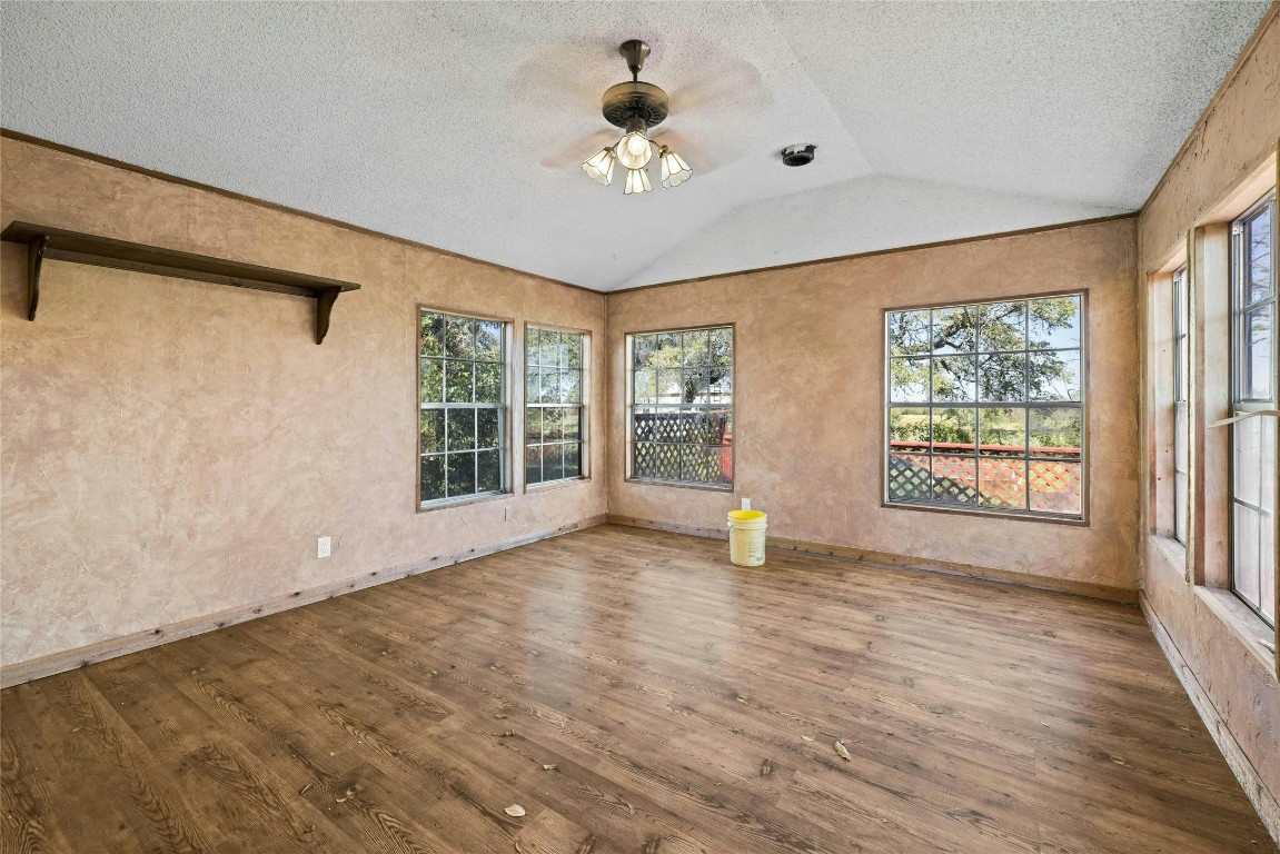14410 Hero Way West Leander, TX 78641 - Photo 29 of 39 a view of an empty room with a window and wooden floor
