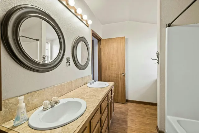 a bathroom with a sink and a mirror