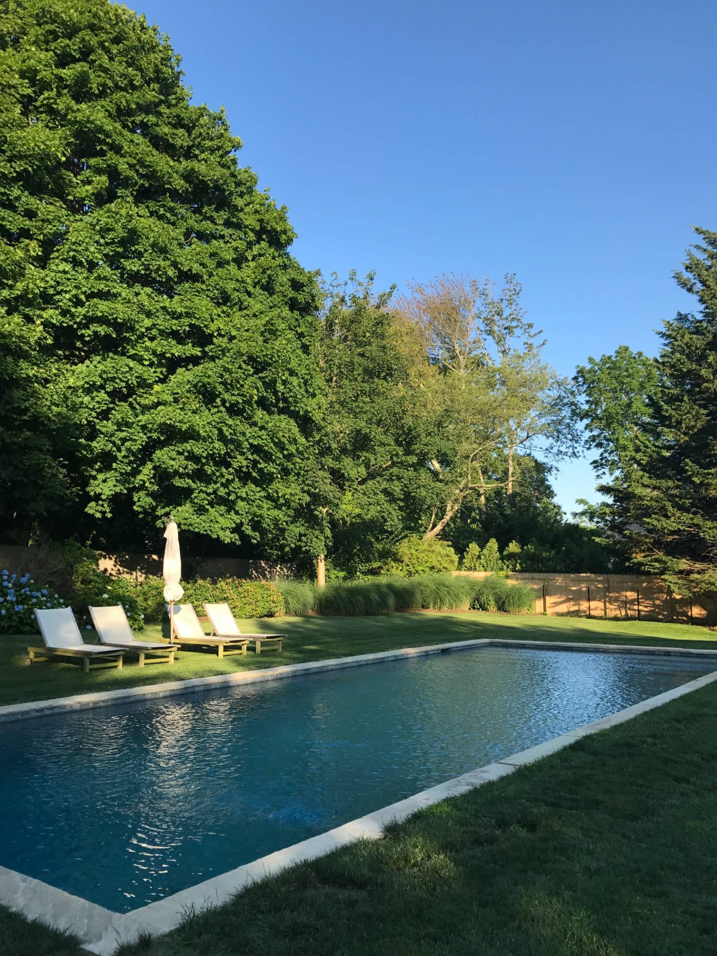 Undisclosed Address Bridgehampton, NY 11932 - Photo 18 of 19 a view of a lake with green space