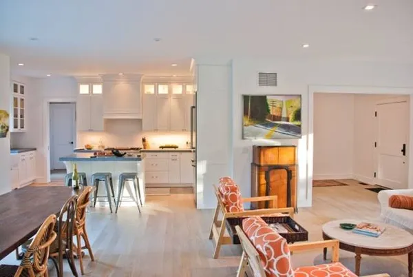 a view of a dining room with furniture and a kitchen