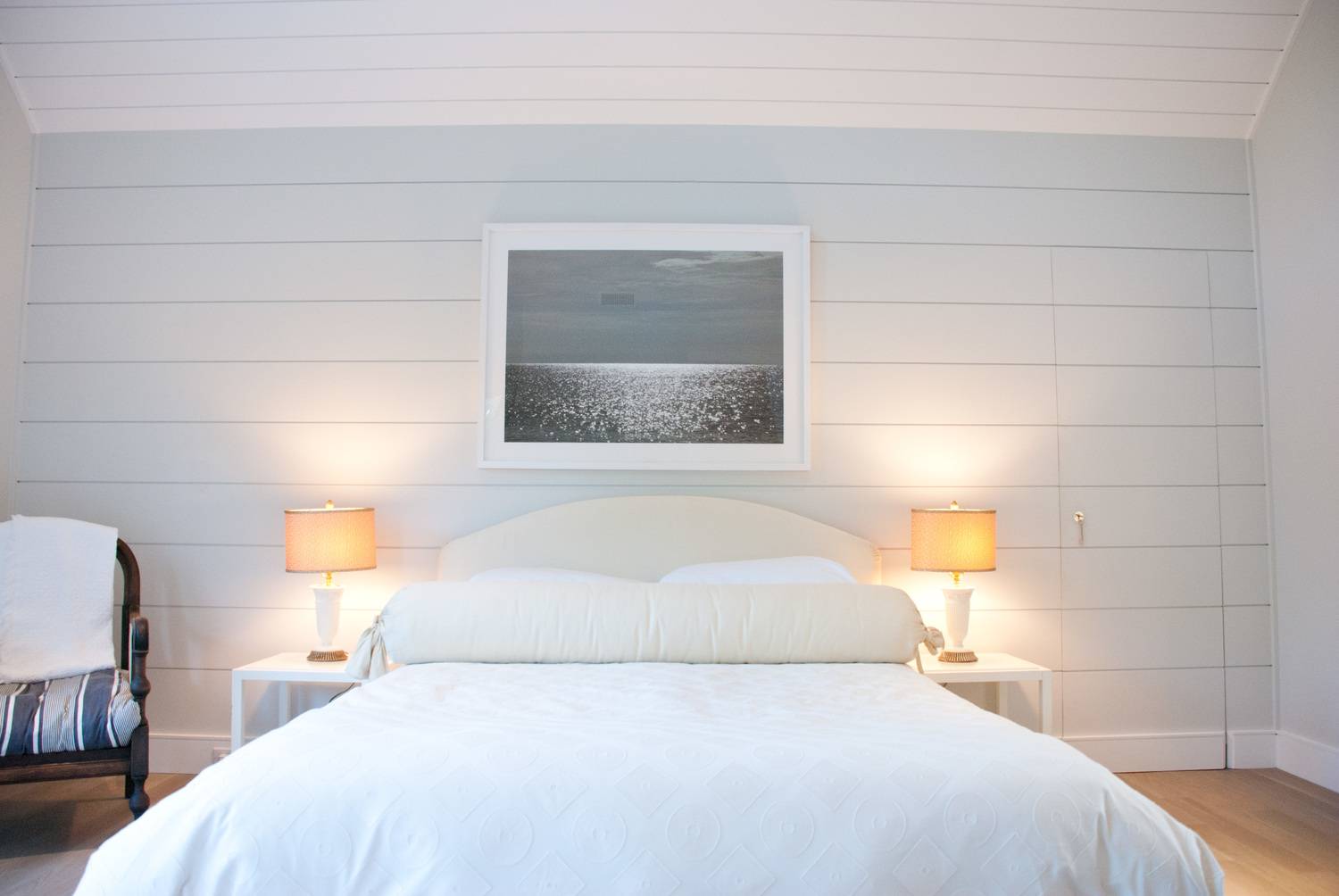 Undisclosed Address Bridgehampton, NY 11932 - Photo 10 of 19 a bedroom with a bed and a night stand