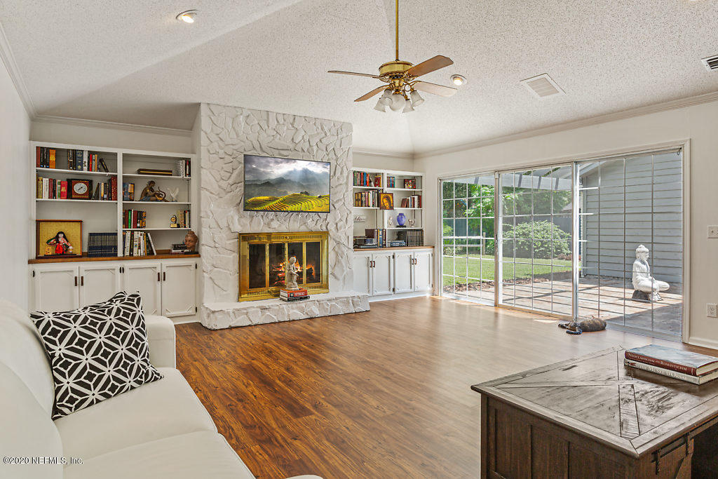 9625 Beauclerc Bluff Road Jacksonville, FL 32257 - Photo 13 of 30 a living room with furniture large window and wooden floor