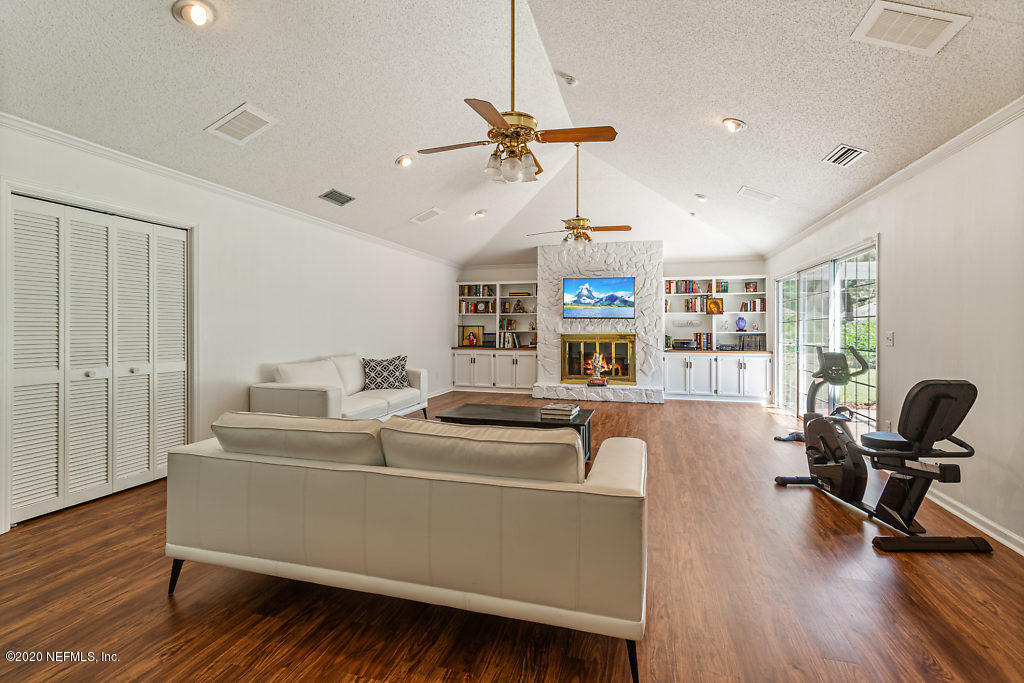 9625 Beauclerc Bluff Road Jacksonville, FL 32257 - Photo 14 of 30 a living room with furniture and a wooden floor