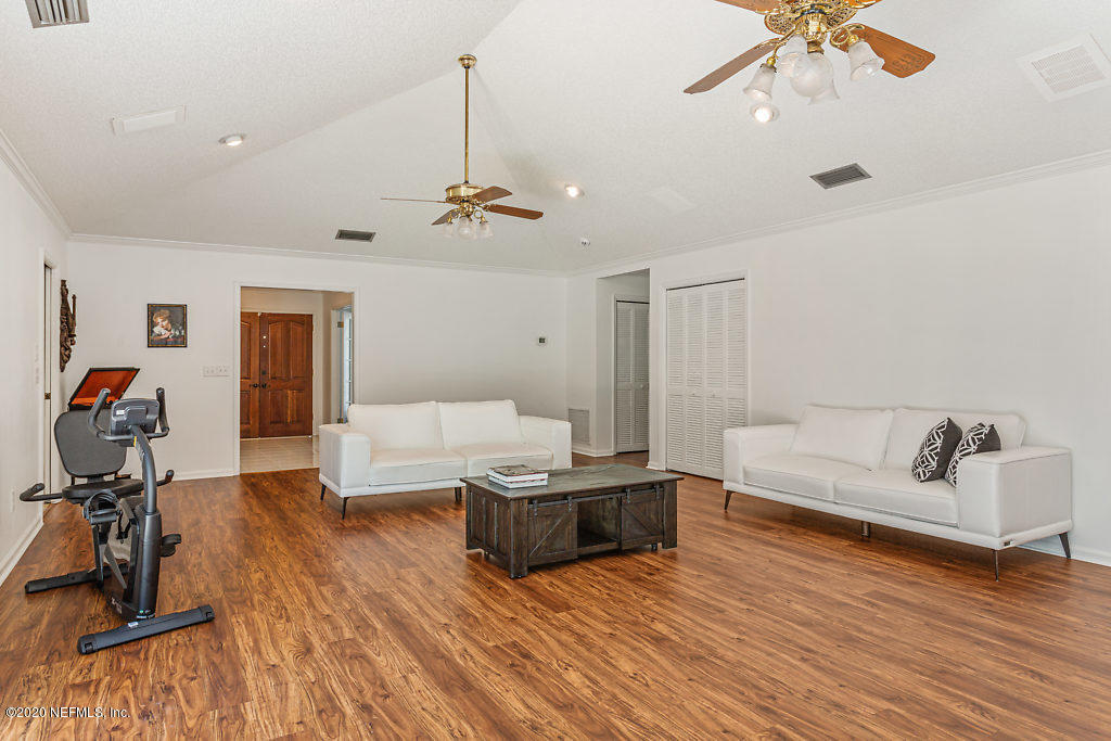 9625 Beauclerc Bluff Road Jacksonville, FL 32257 - Photo 15 of 30 a living room with furniture and a wooden floor