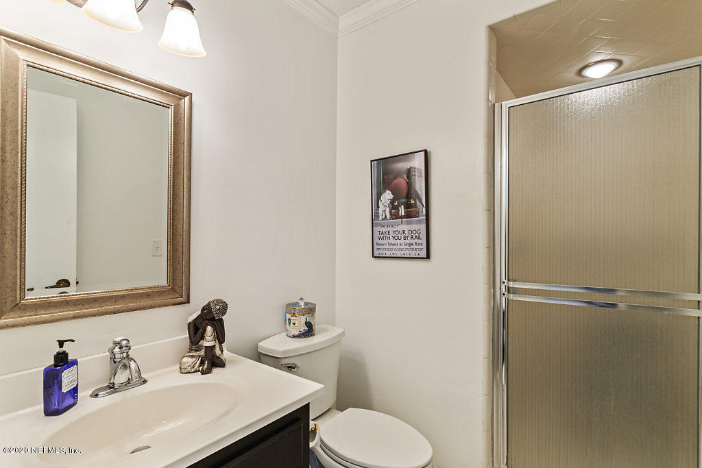 9625 Beauclerc Bluff Road Jacksonville, FL 32257 - Photo 25 of 30 a bathroom with a sink toilet and vanity