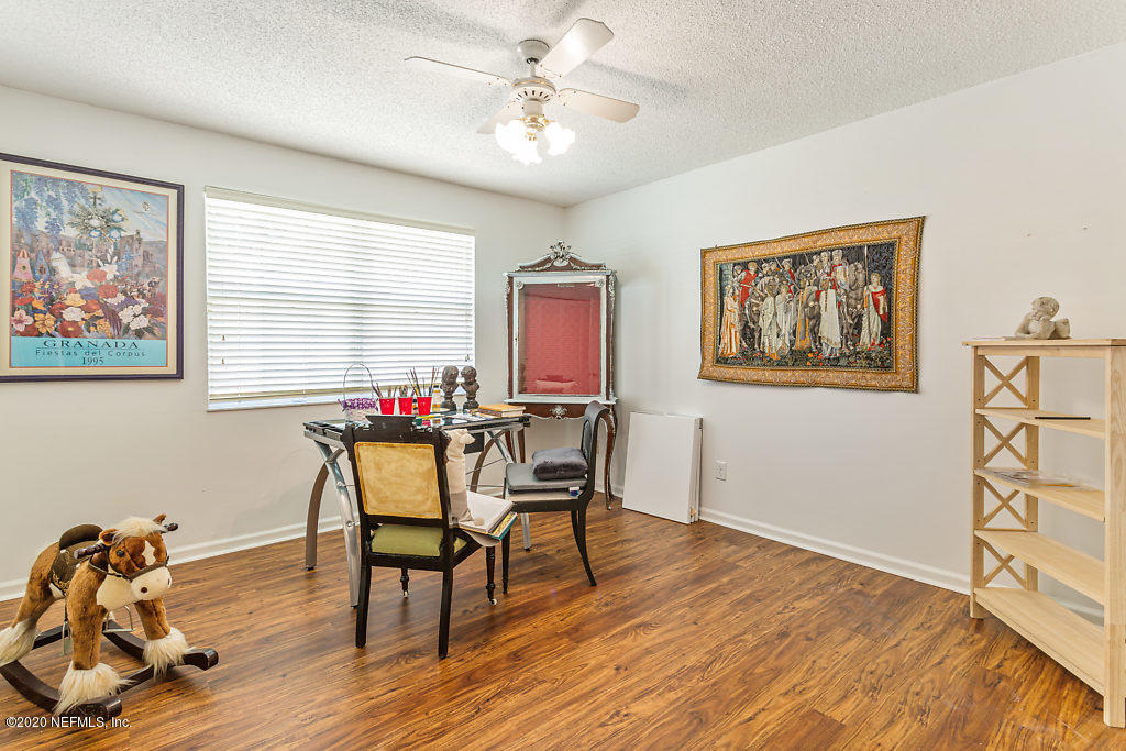 9625 Beauclerc Bluff Road Jacksonville, FL 32257 - Photo 26 of 30 a dining room with furniture and window