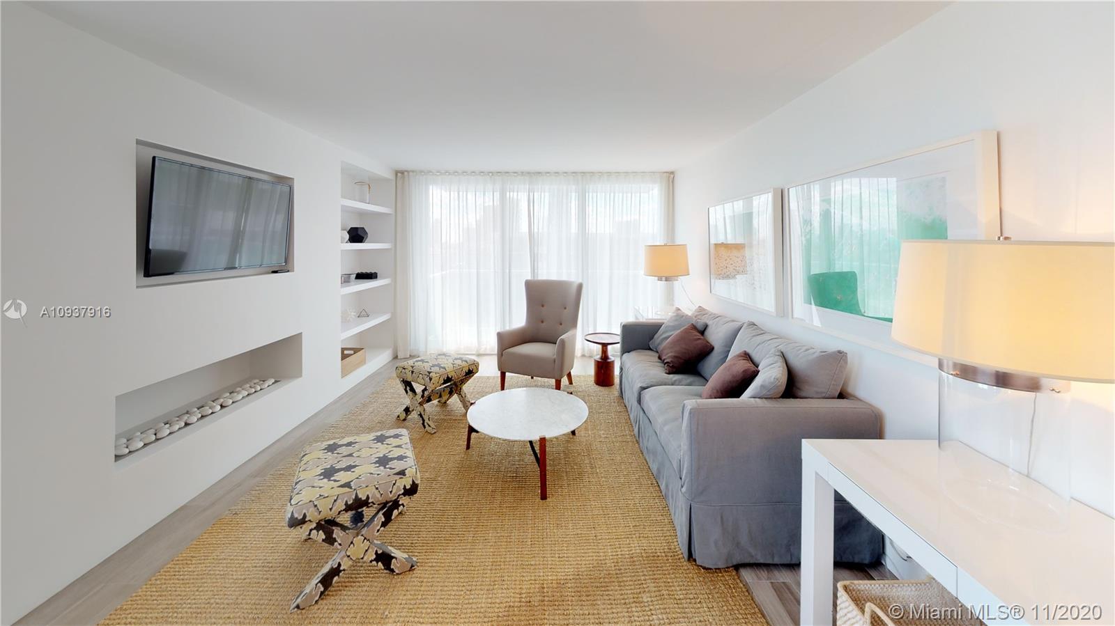 West Avenue Miami Beach, FL 33139 - Photo 1 of 29 a living room with furniture and a large window