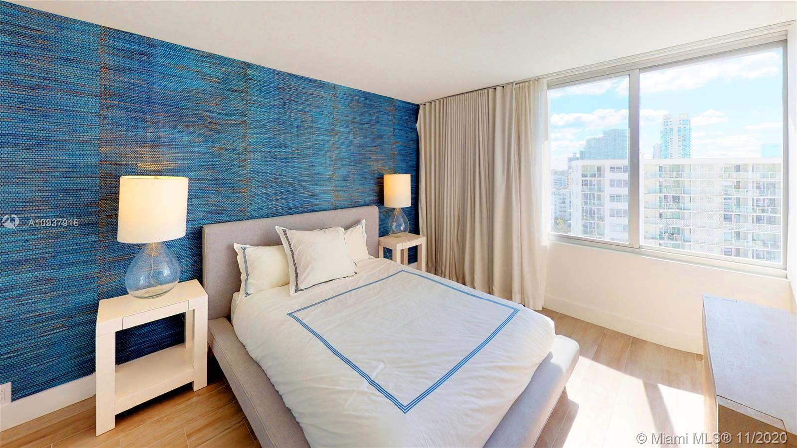 West Avenue Miami Beach, FL 33139 - Photo 14 of 29 a bed room with a bed and a night stand