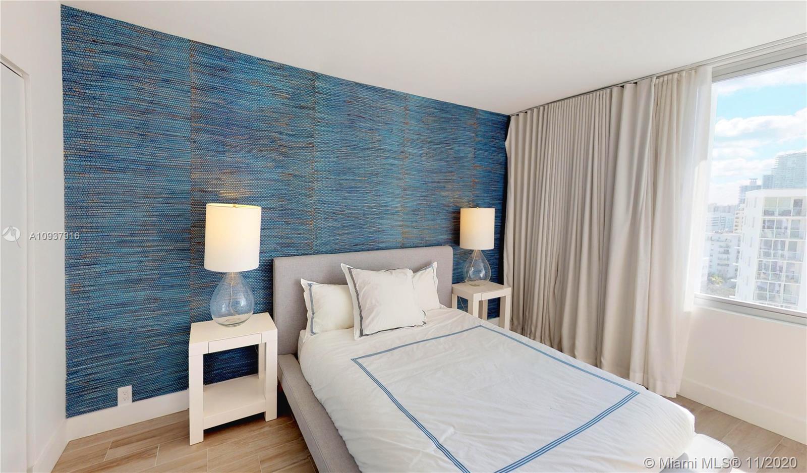 West Avenue Miami Beach, FL 33139 - Photo 17 of 29 a bedroom with a bed and a window