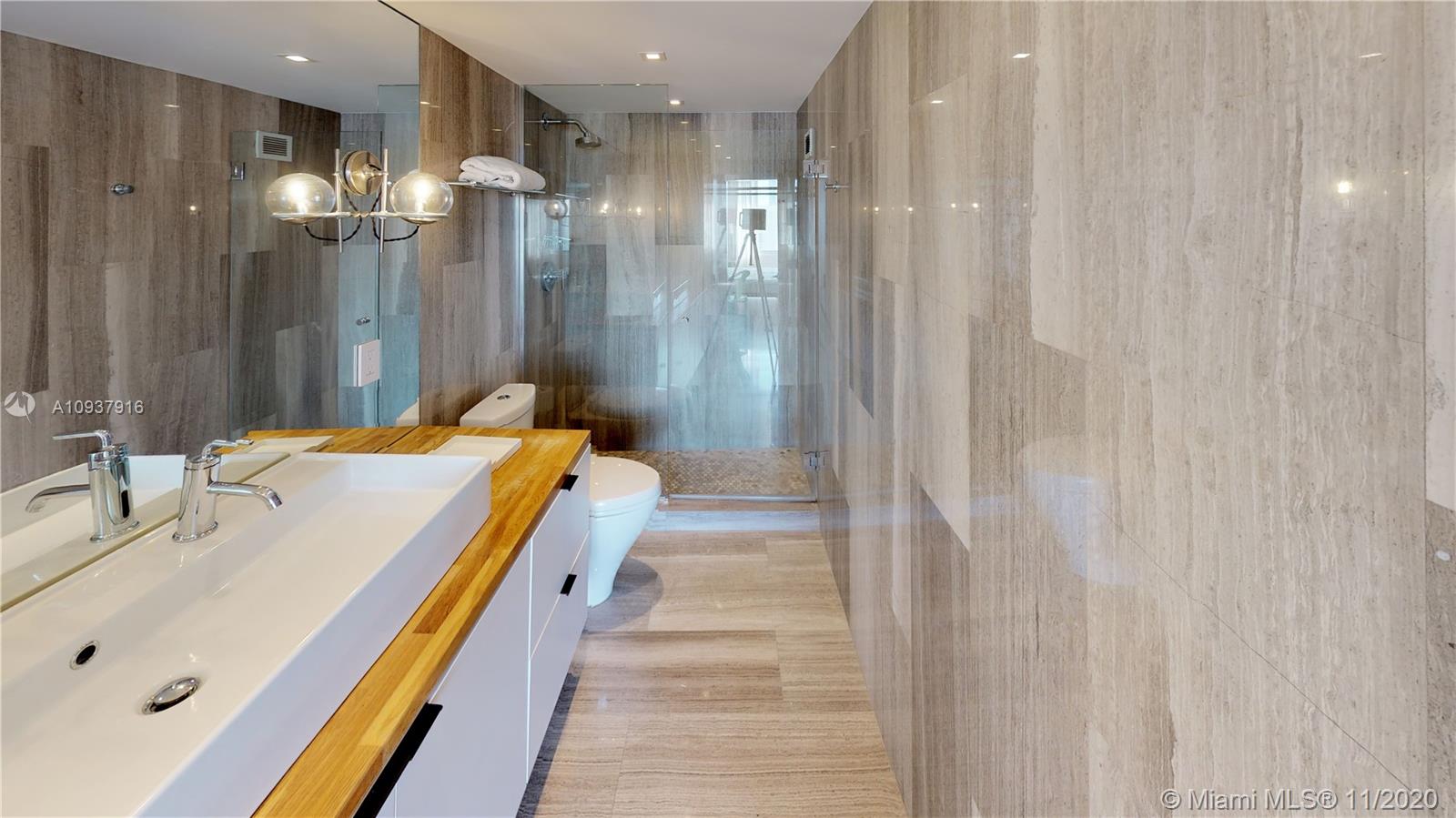 West Avenue Miami Beach, FL 33139 - Photo 18 of 29 a bathroom with a tub and shower