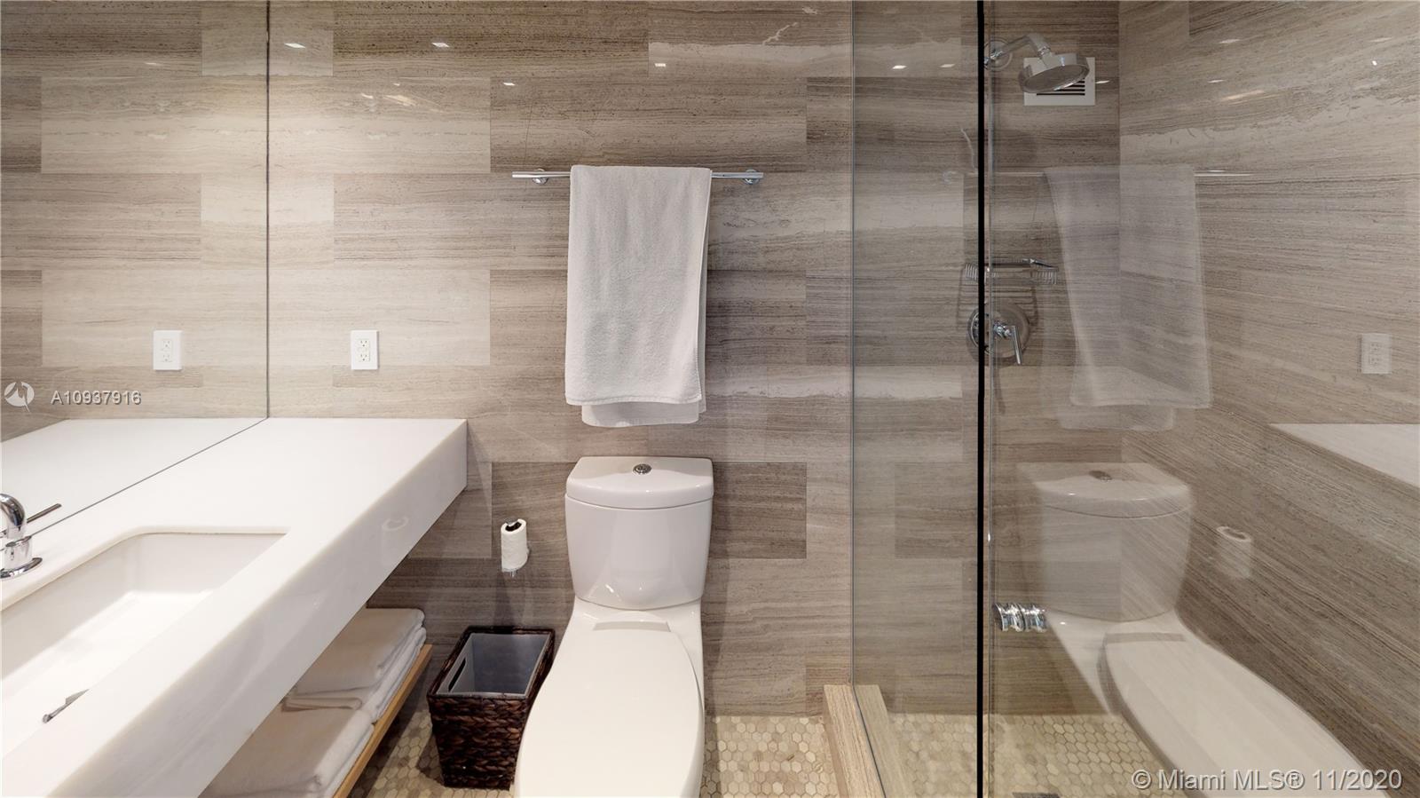 West Avenue Miami Beach, FL 33139 - Photo 19 of 29 a bathroom with a bathtub and shower