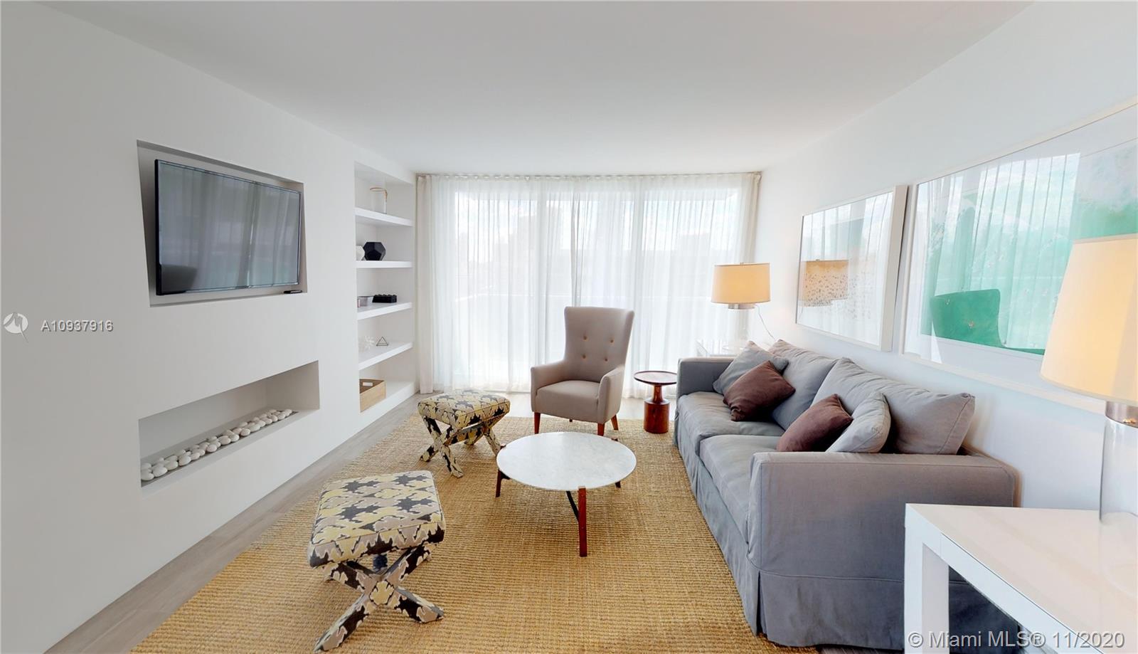 West Avenue Miami Beach, FL 33139 - Photo 3 of 29 a living room with furniture and a fireplace