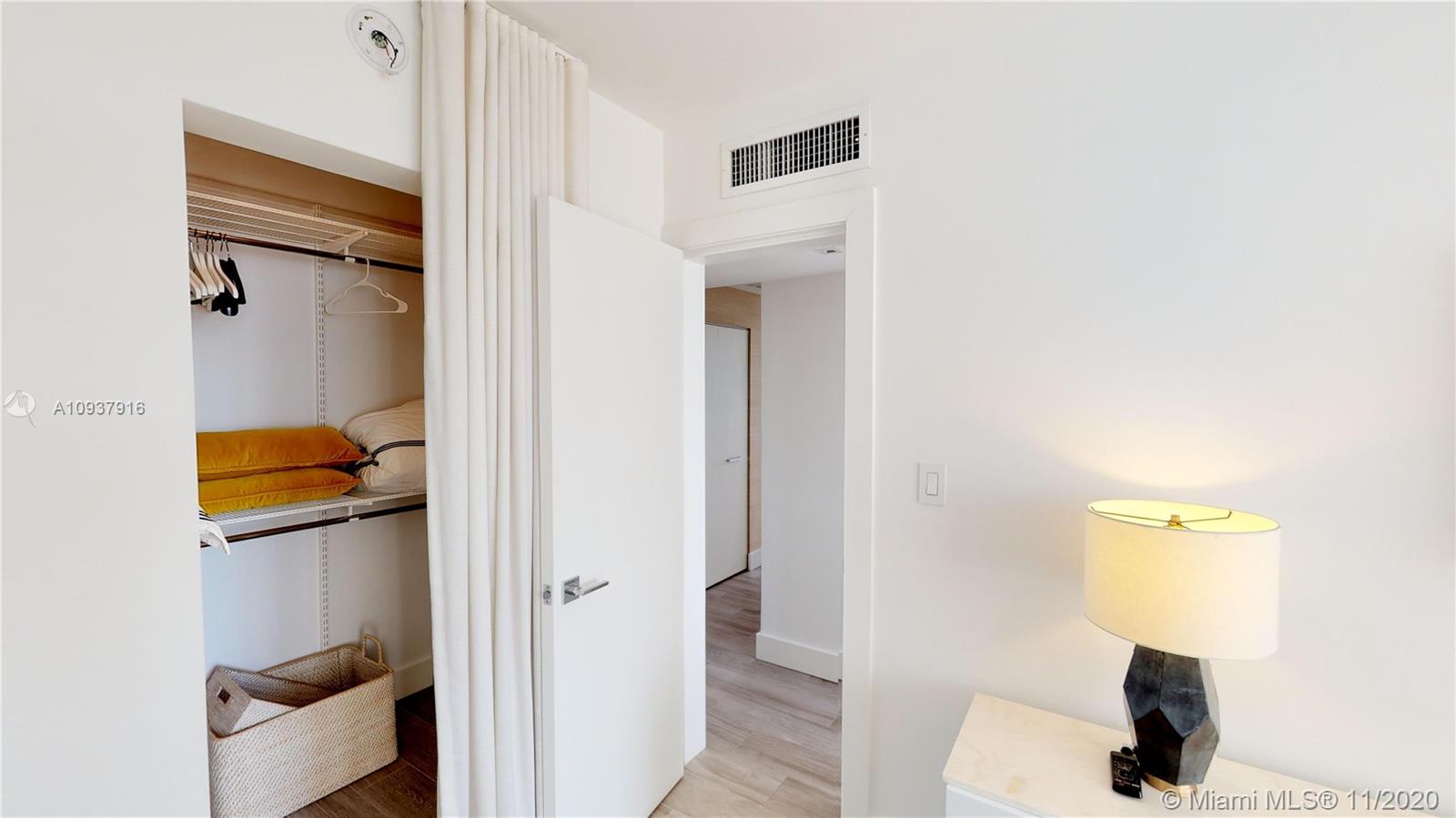 West Avenue Miami Beach, FL 33139 - Photo 23 of 29 a bathroom with a sink and a mirror