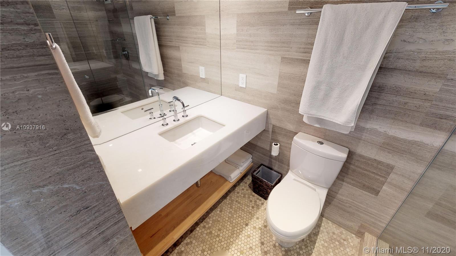 West Avenue Miami Beach, FL 33139 - Photo 25 of 29 a bathroom with a sink and toilet