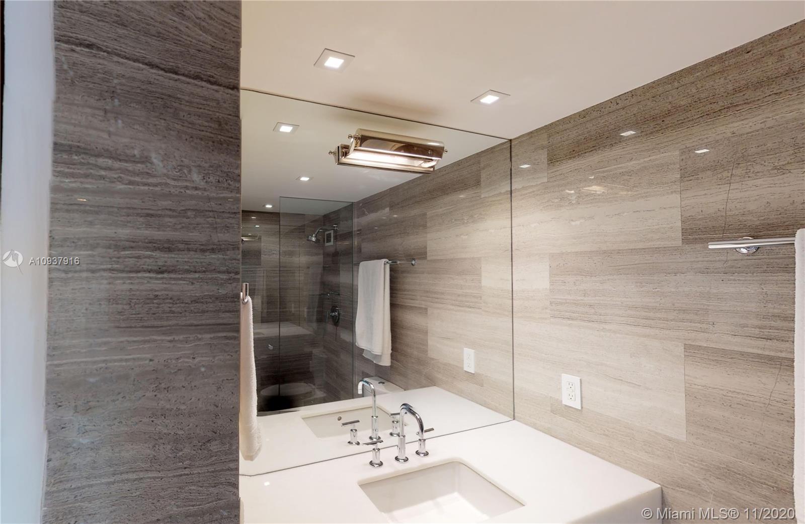 West Avenue Miami Beach, FL 33139 - Photo 26 of 29 a bathroom with a shower and a sink