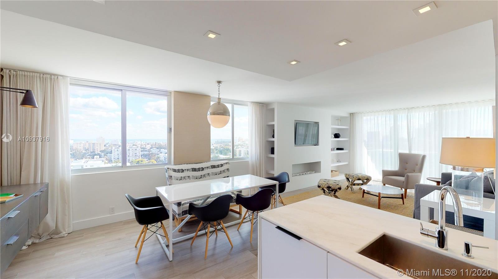 West Avenue Miami Beach, FL 33139 - Photo 4 of 29 a living room with furniture and a large window