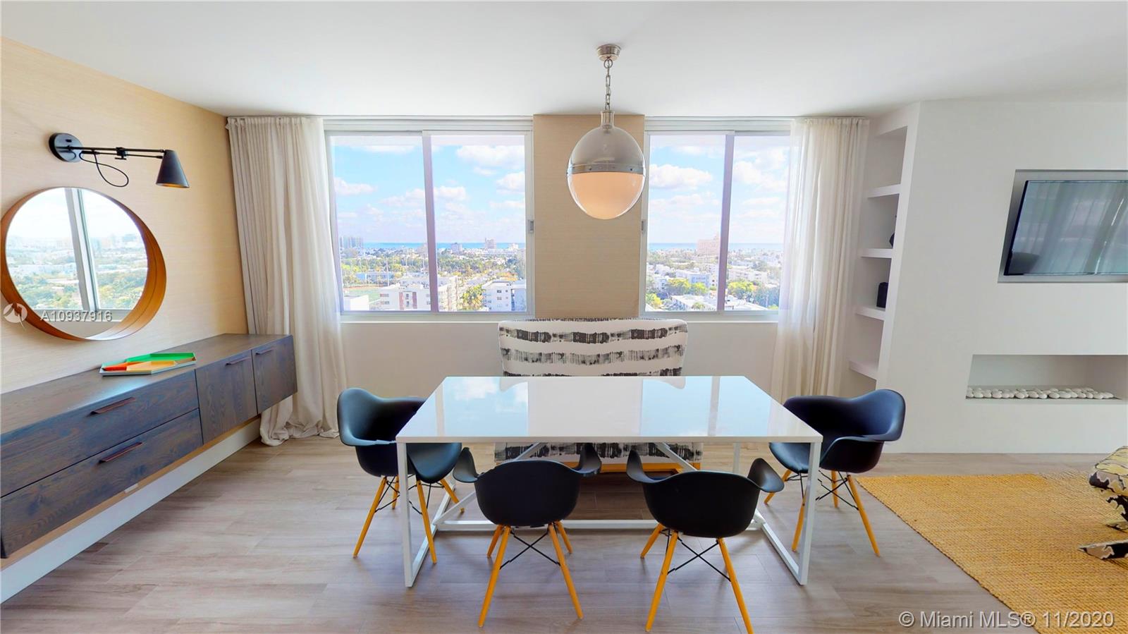 West Avenue Miami Beach, FL 33139 - Photo 5 of 29 a large dining space with furniture window and wooden floor