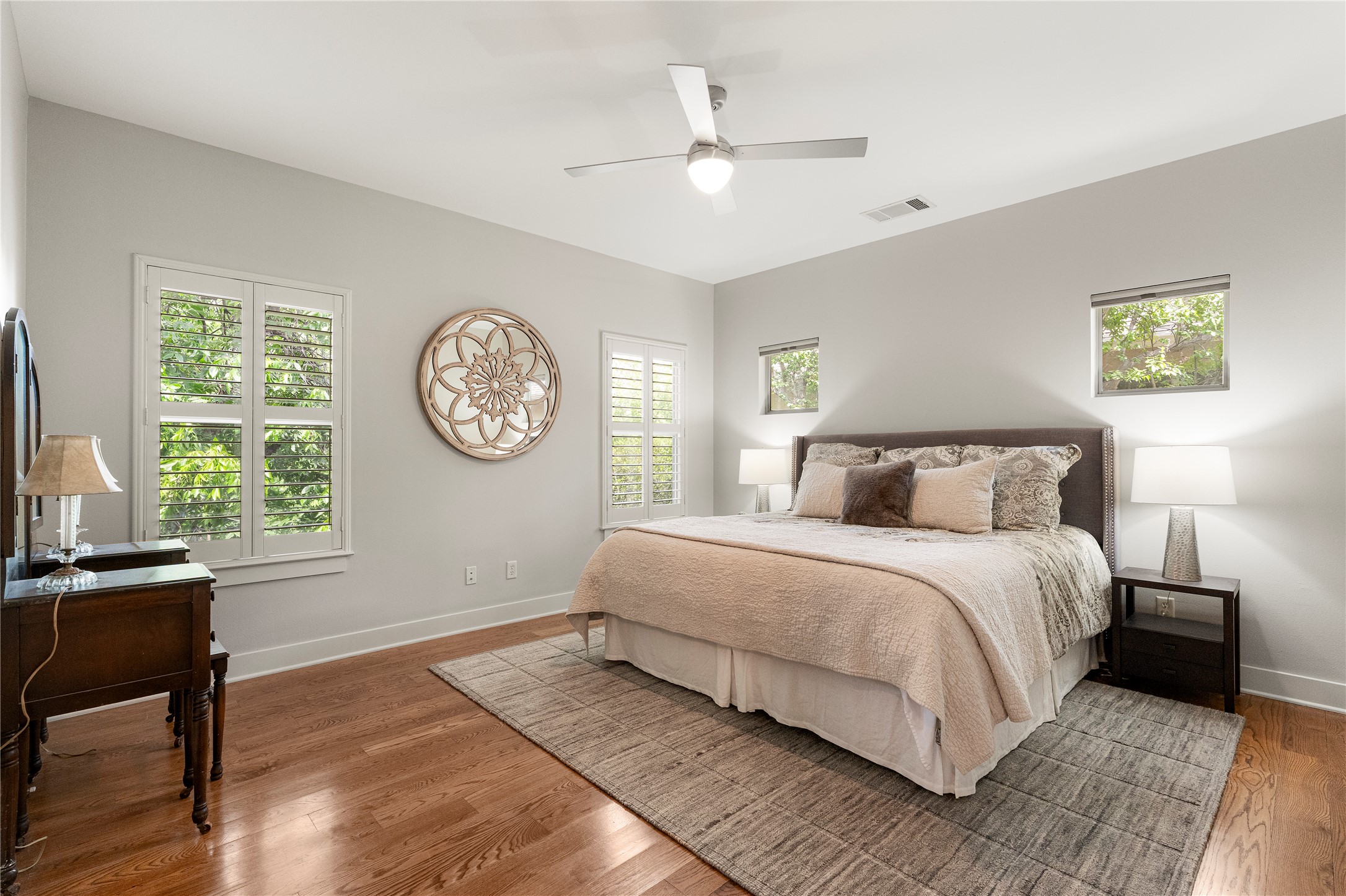 3814 Ridgelea Drive, Unit A Austin, TX 78731 - Photo 25 of 30 a spacious bedroom with a large bed and a large window