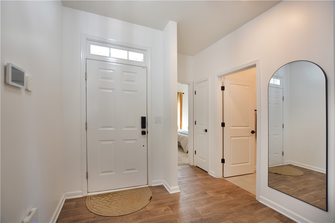 242 Hillendale Way Pelzer, SC 29669 - Photo 3 of 19 Step into this welcoming entry, featuring durable flooring and crisp white trim for an inviting atmosphere.