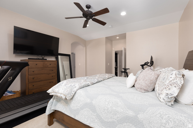 1257 West 2320 South St. George, UT 84770 - Photo 17 of 55 Bedroom featuring a ceiling fan with light fixture, recessed lighting, and an arched doorway