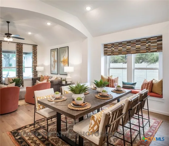 a view of a dining room with furniture window and outside view