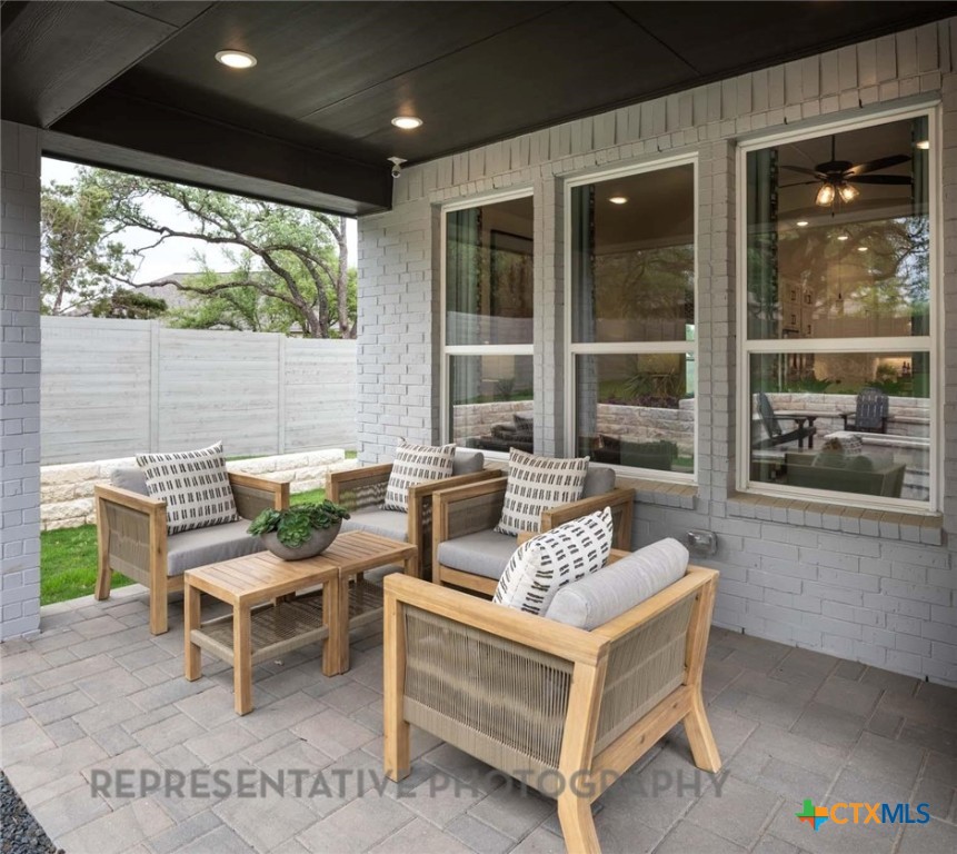 620 High Summit Drive Georgetown, TX 78628 - Photo 13 of 28 a outdoor living space with furniture and a potted plant