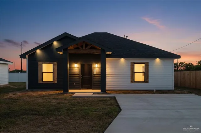 a front view of a house with yard