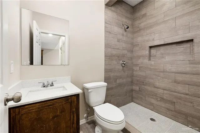 a bathroom with a sink toilet and shower