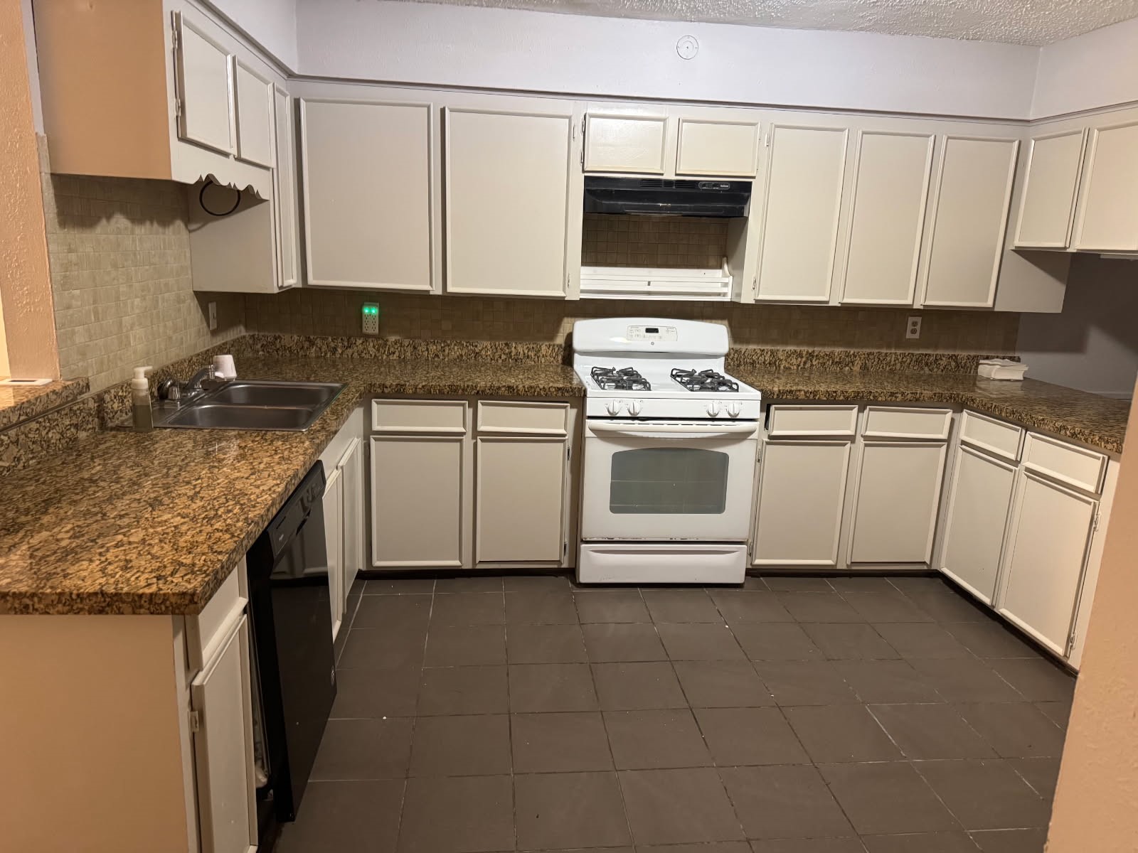 9537 Braeburn Glen Boulevard Houston, TX 77074 - Photo 15 of 15 a kitchen with stainless steel appliances granite countertop a stove a sink and a microwave