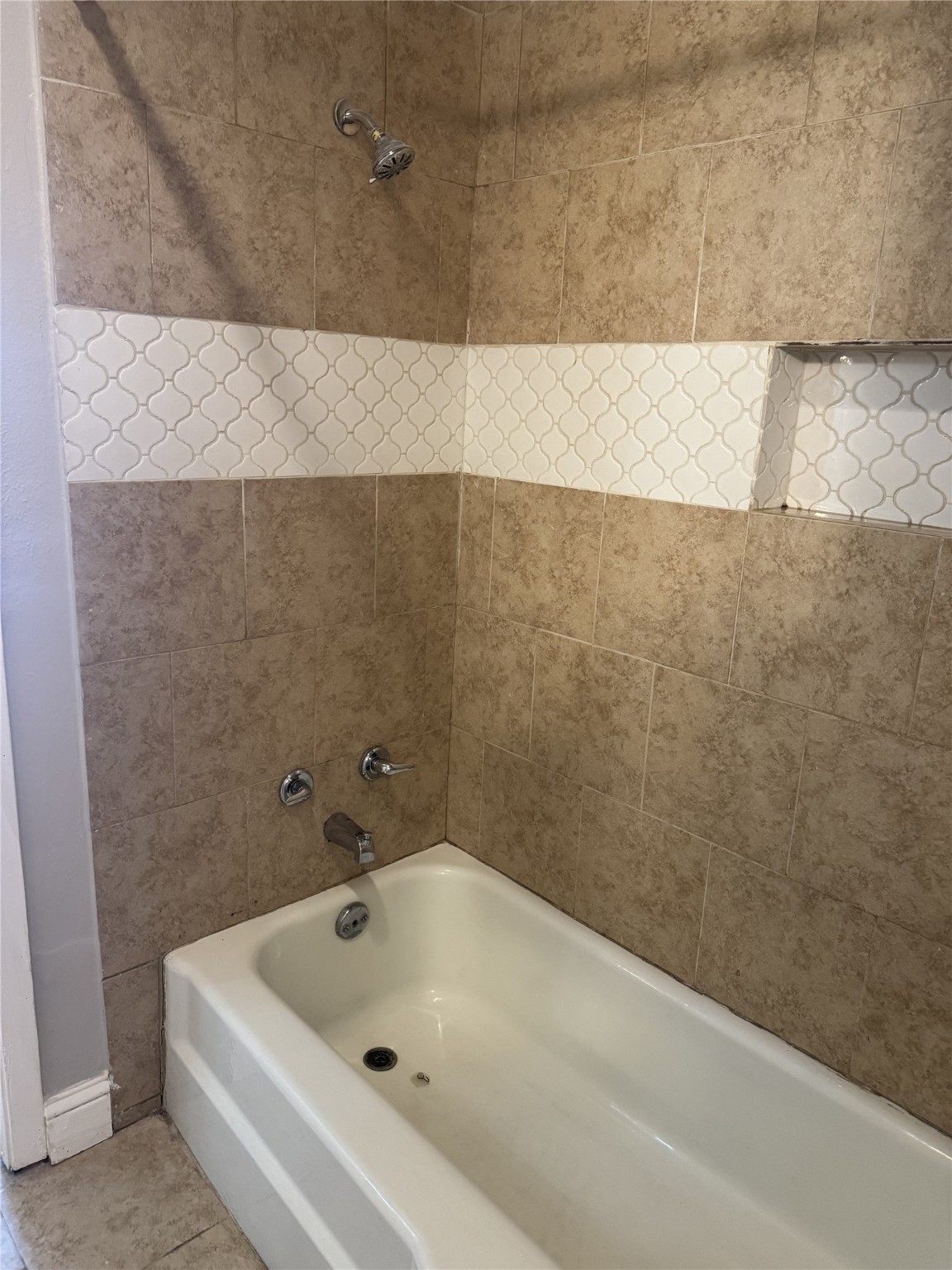 9537 Braeburn Glen Boulevard Houston, TX 77074 - Photo 6 of 15 a bathroom with a bathtub