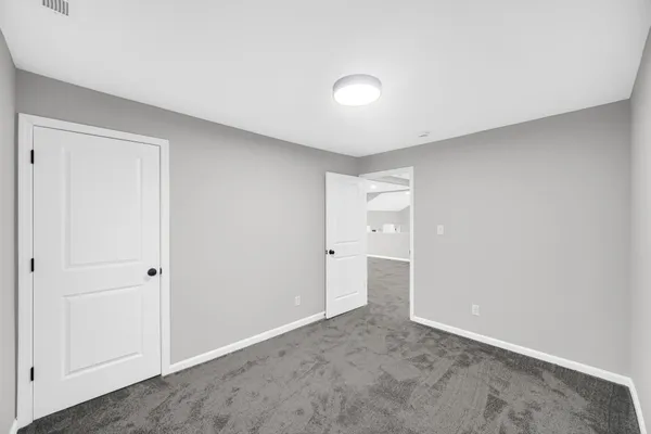a view of empty room with ceiling fan