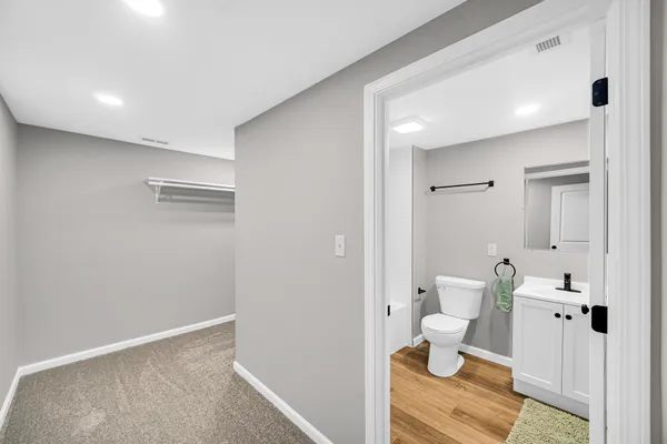 a bathroom with a toilet sink and shower