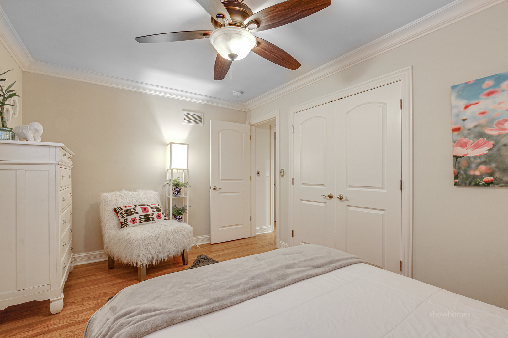 485 East Westleigh Road Lake Forest, IL 60045 - Photo 12 of 22 a bedroom with a bed and a chandelier