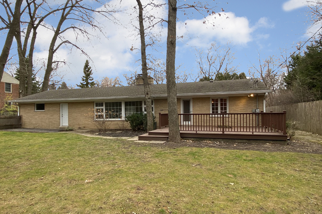 485 East Westleigh Road Lake Forest, IL 60045 - Photo 20 of 22 a view of a house with a small yard plants and large tree