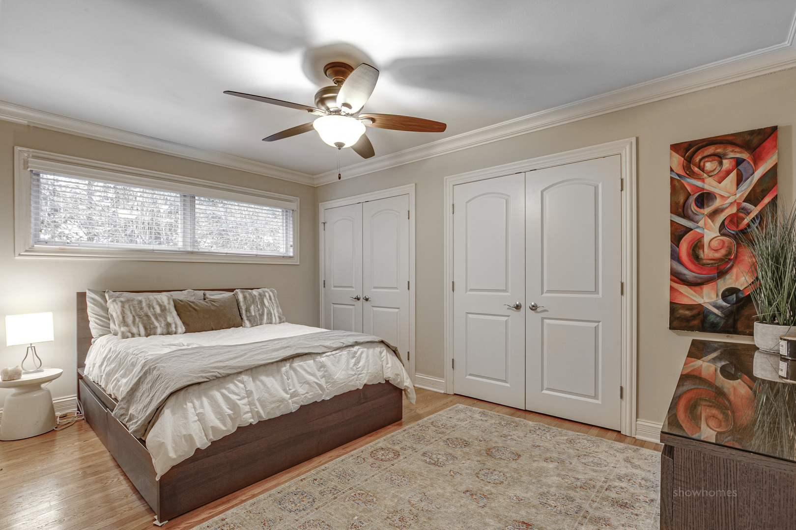 485 East Westleigh Road Lake Forest, IL 60045 - Photo 10 of 22 a bedroom with a bed and a chandelier