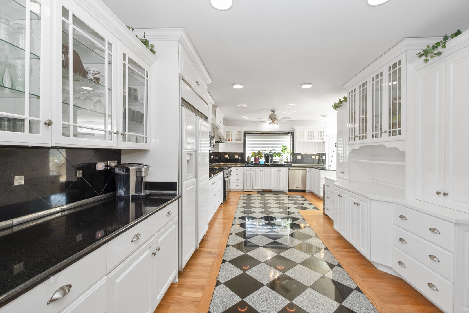739 Aberdeen Drive Crete, IL 60417 - Photo 2 of 35 a large white kitchen with granite countertop a stove a sink and dishwasher