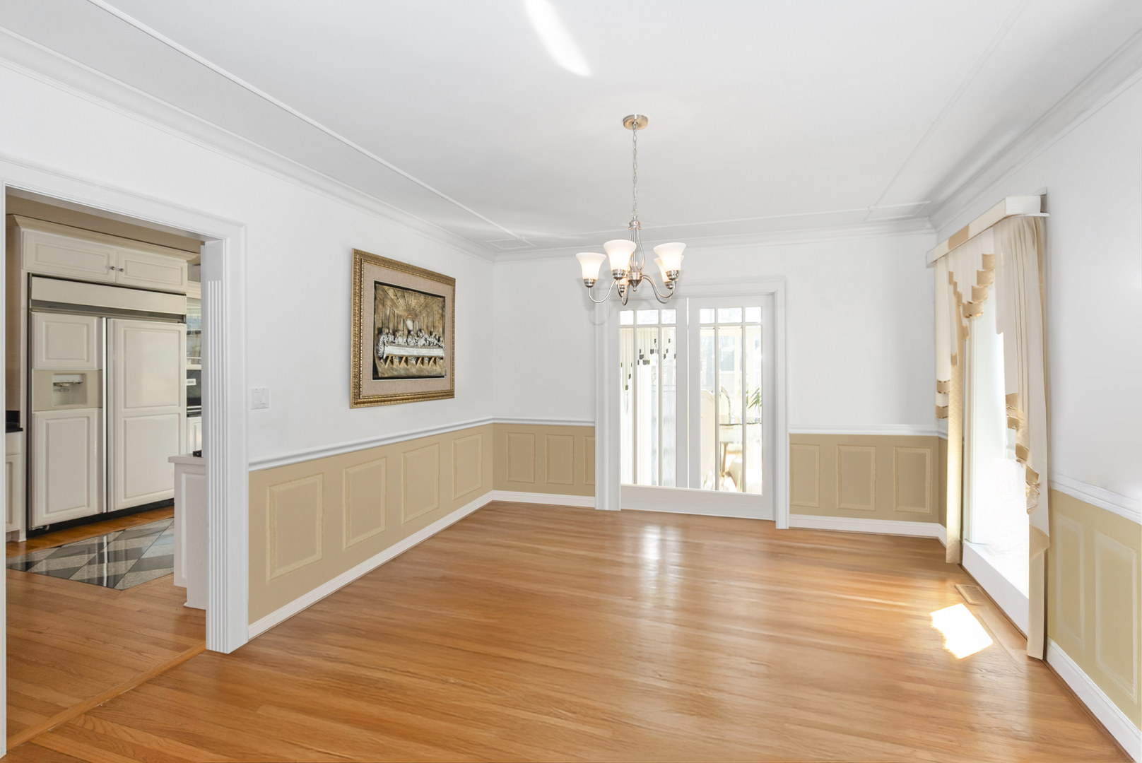 739 Aberdeen Drive Crete, IL 60417 - Photo 5 of 35 a view of a livingroom with wooden floor and a chandelier