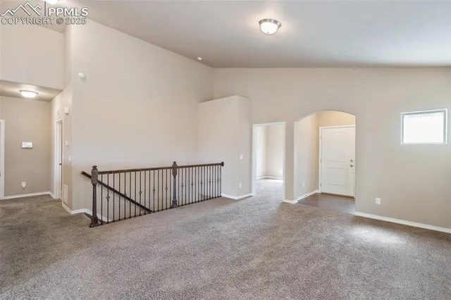 a view of a kitchen with a sink and dishwasher a refrigerator with wooden floor
