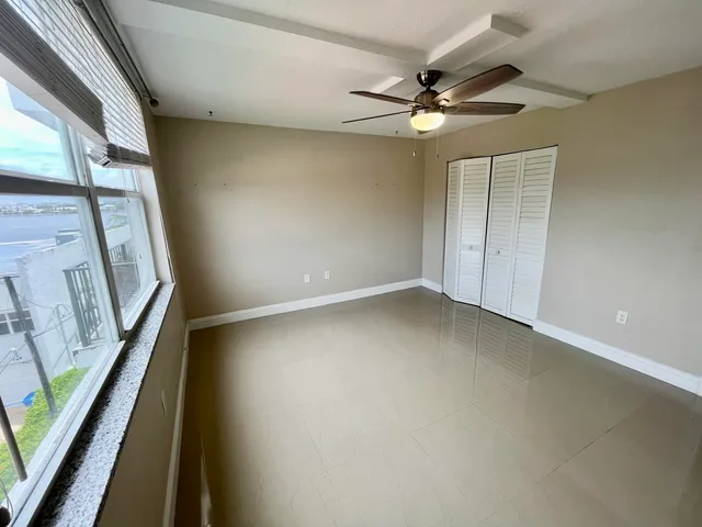 a view of an empty room with a window