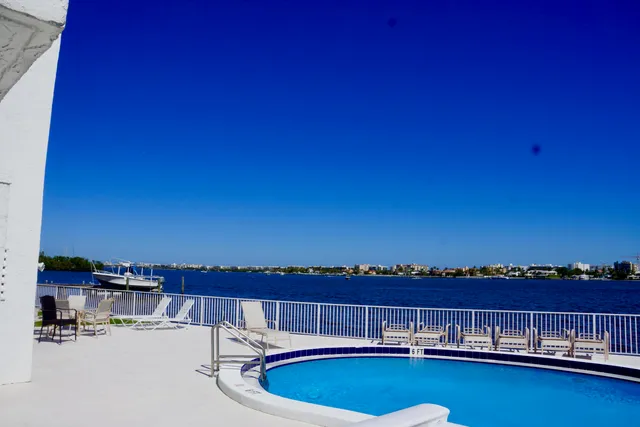 a view of a swimming pool with an ocean view